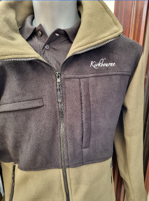 Kirkbourne Spaniels fleece with green mesh lining and four zipped pockets - warm gundog training fleece worn by Darren Kirk