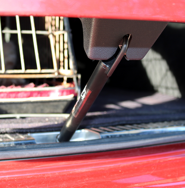 AK-9 Vent Lock fitted between car boot lid and lock, holding boot open for dog ventilation