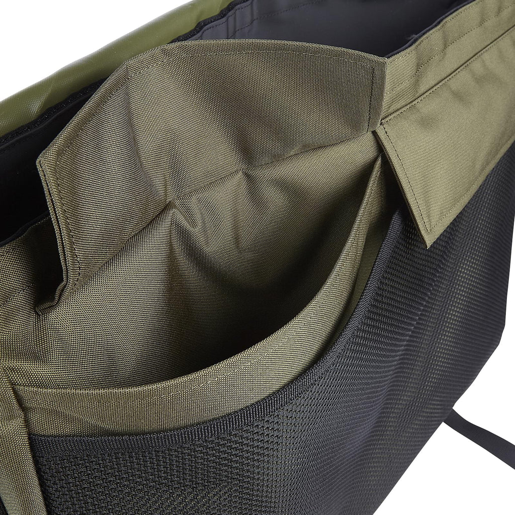 Pocket detail of Dog and Field large game and dummy bag in olive green - two large external pockets and front mesh net for additional dummy game and training accessory storage during gundog training sessions and field trials