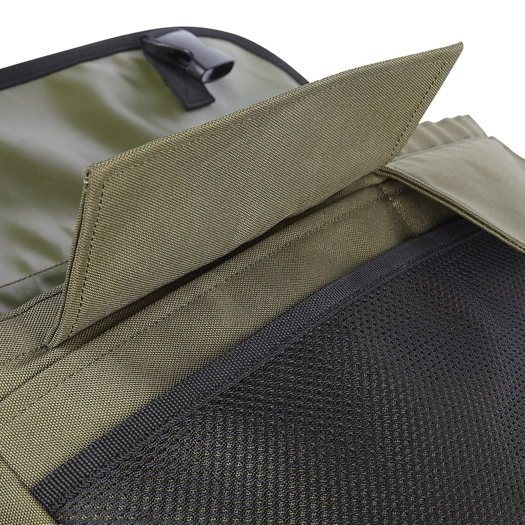Pocket detail of Dog and Field medium game and dummy bag in olive green - two large external pockets and front mesh net for additional dummy game and training accessory storage in the field