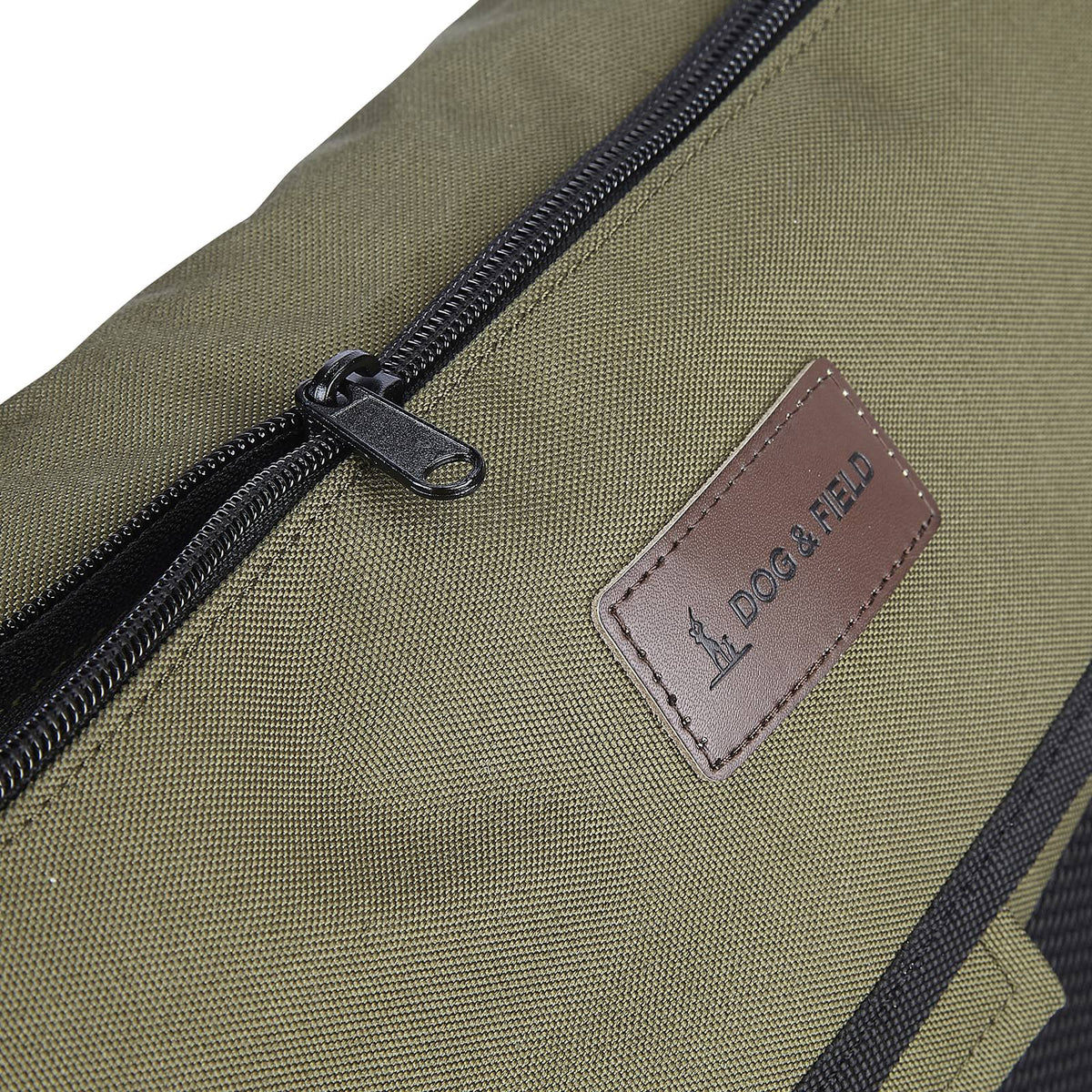 Zip detail of Dog and Field medium game and dummy bag in olive green - flap zipper pocket for secure phone and key storage with washable removable inner liner for easy cleaning after gundog training sessions