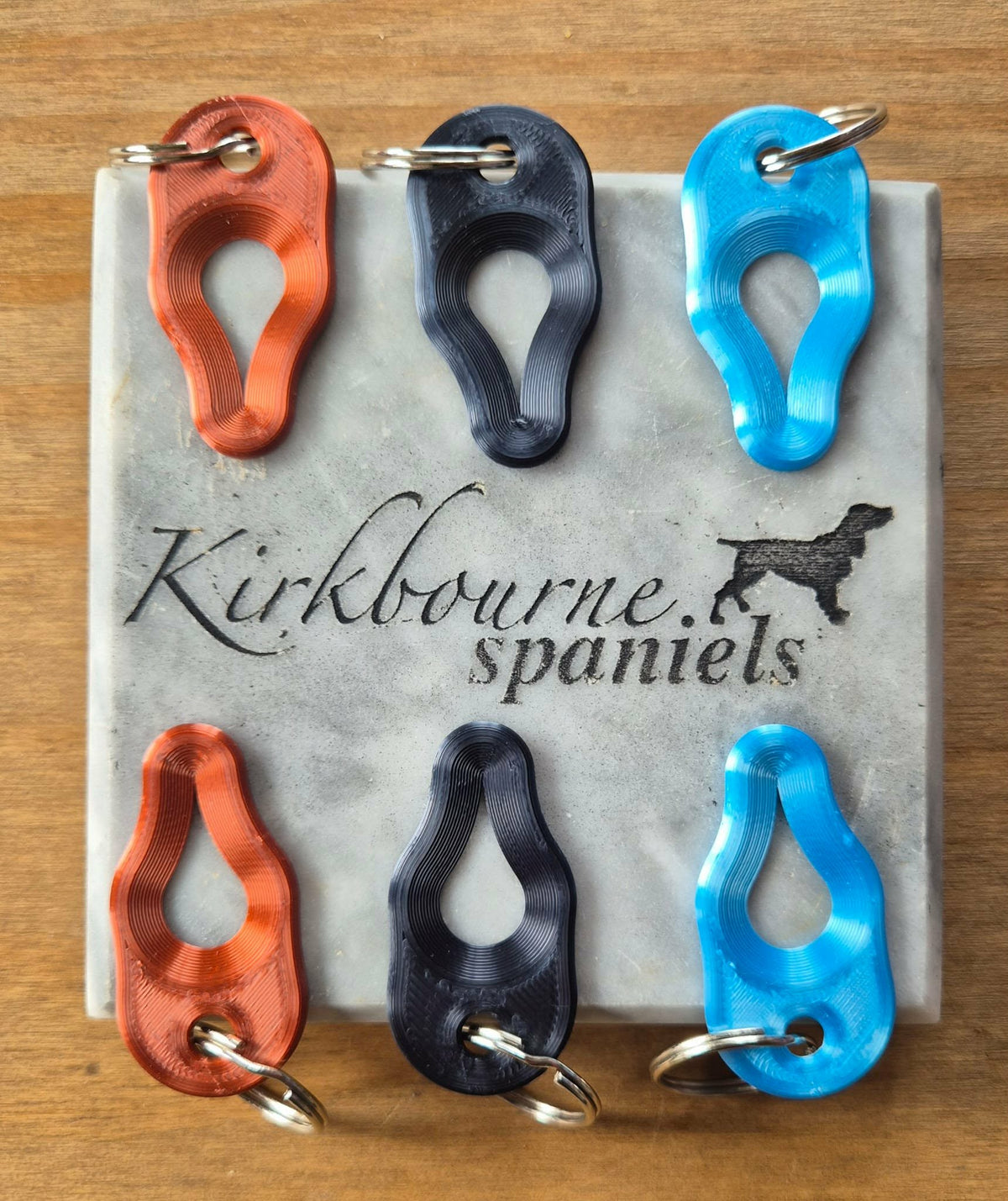 Kirkbourne Spaniels tick pullers in all three colours - sky blue copper and black PLA plant-based bioplastic straight-pull tick removal tools with keyring attachment non-toxic pet safe and biodegradable for dogs and handlers