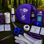Leucillin Poorly Paws first aid kit contents laid out - 30ml Leucillin antiseptic sterile wipes gloves tick removers tweezers tourniquet scissors dressing pads bandages and microporous tape winner of Pet Quip and PIF awards